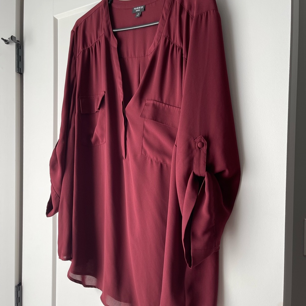Like new Torrid Harper 3X burgundy blouse. Worn once.